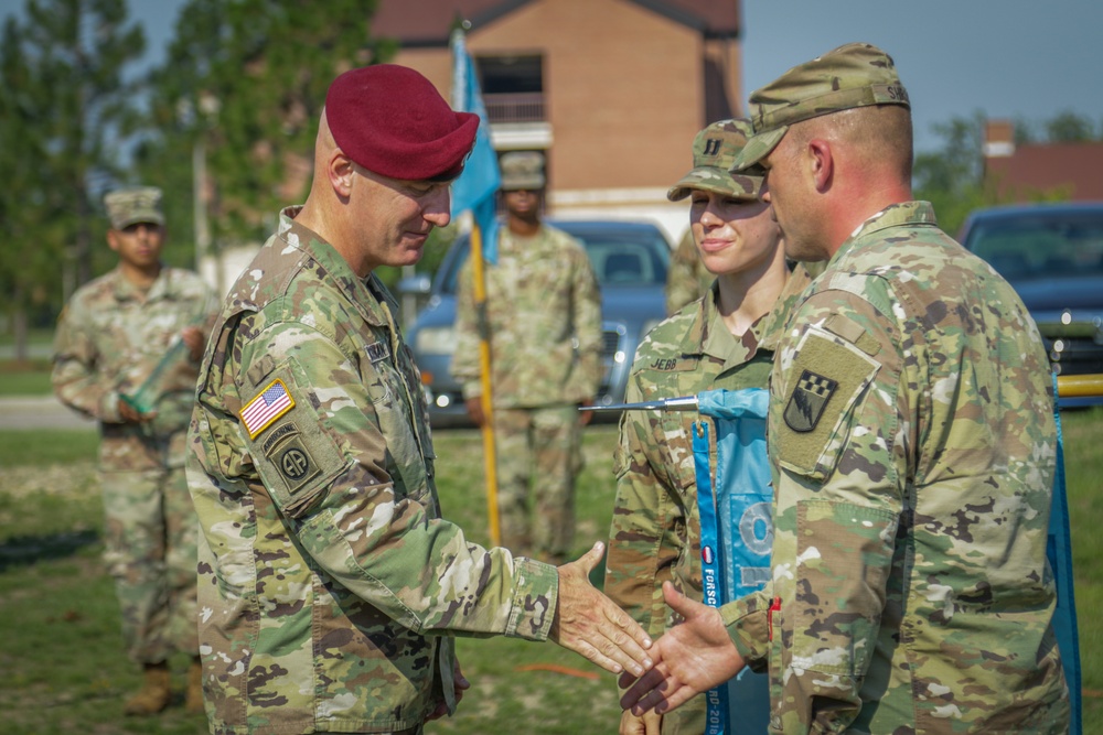 Maj. Gen. Brian J. McKiernan congratulates 1st Sgt. Aaron Shrock