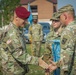 Maj. Gen. Brian J. McKiernan congratulates 1st Sgt. Aaron Shrock