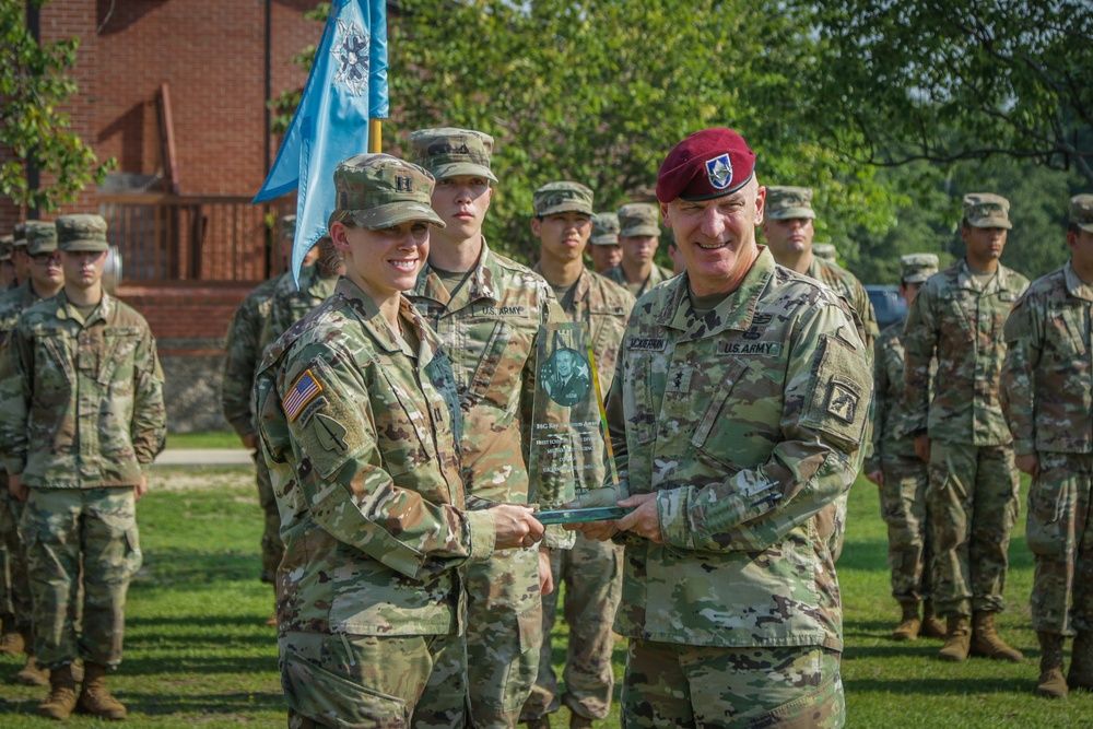 Maj. Gen. Brian J. McKiernan presents the Brig. Gen. Roy M. Strom award to Capt. Heather Jebb