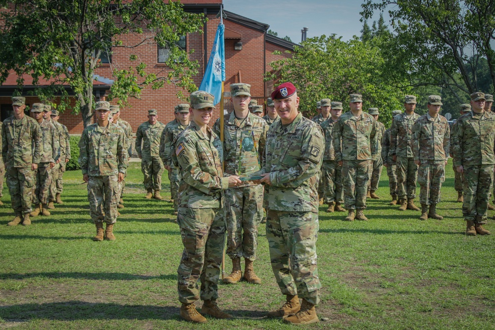 Maj. Gen. Brian J. McKiernan presents Brig. Gen. Roy M. Strom award to Capt. Heather Jebb