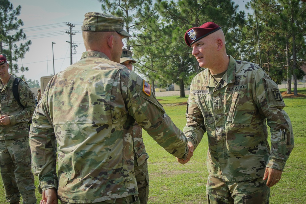 Maj. Gen. Brian J. McKiernan congratulates 1st Sgt. Aaron Shrock