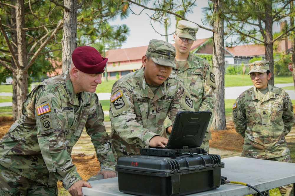 Spc. Gerome Cagaoan conducts equipment demonstration for Maj. Gen. Brian J. McKiernan