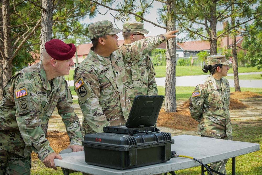 Spc. Gerome Cagaoan conducts equipment demonstration for Maj. Gen. Brian J. McKiernan