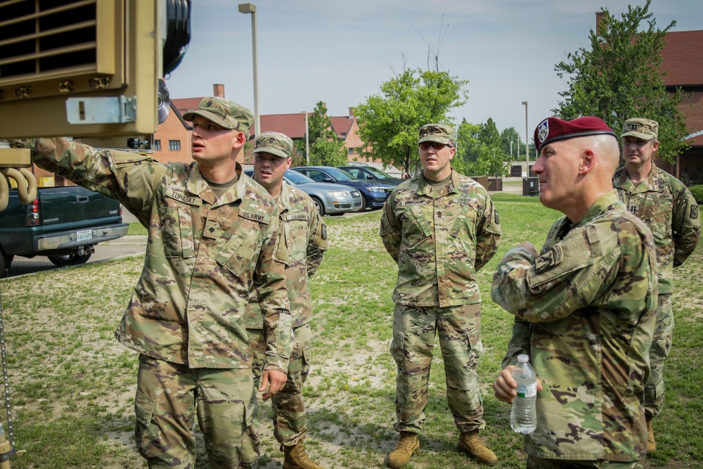 Spc. David Lupasky presents equipment for Maj. Gen. Brian J. McKiernan