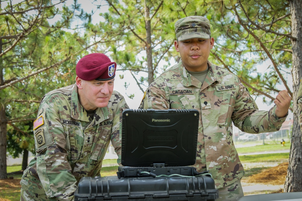 Spc. Gerome Cagaoan conducts equipment demonstration for Maj. Gen. Brian J. McKiernan