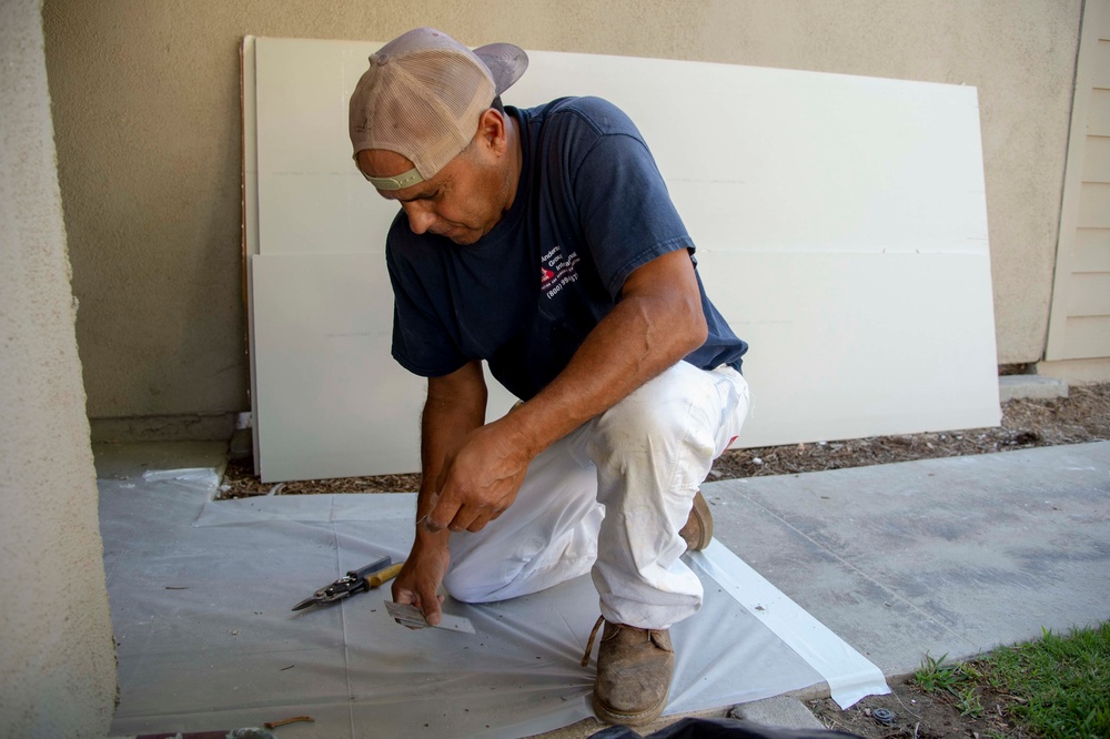 Contractors repair homes on base.