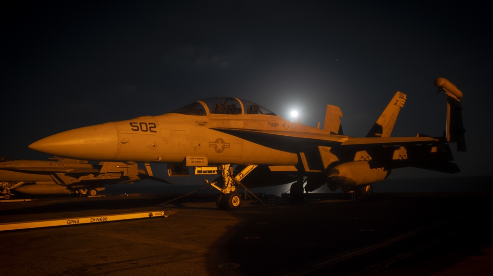 EA-18G Growler Aircraft Sits on Flight Deck at Night