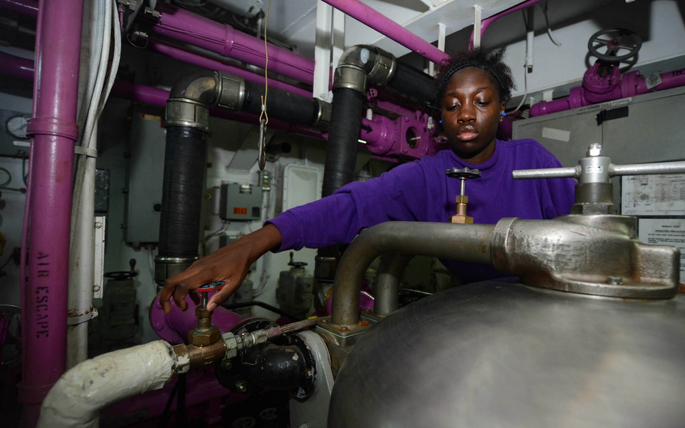 Sailor Operates Fuel System in a Pump Room