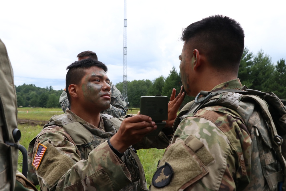 IANG Infantry Soldiers Apply Face Paint at XCTC