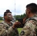 IANG Infantry Soldiers Apply Face Paint at XCTC