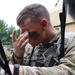 IANG Infantry Soldier Applies Face Paint at XCTC