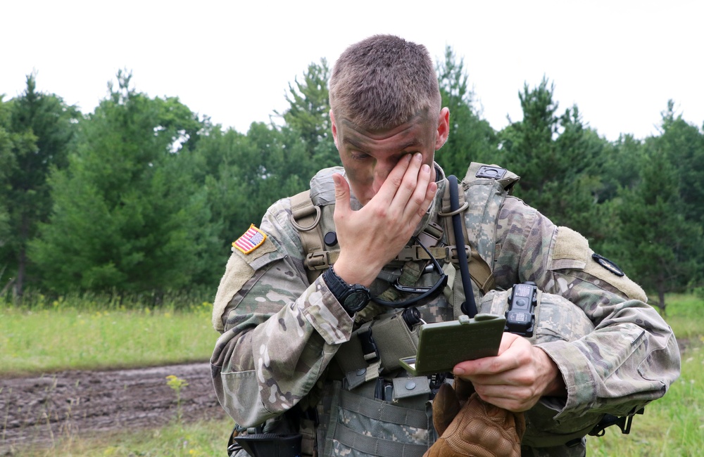 IANG Infantry Soldier Applies Face Paint at XCTC