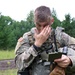 IANG Infantry Soldier Applies Face Paint at XCTC