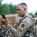 IANG Infantry Soldier Applies Face Paint at XCTC