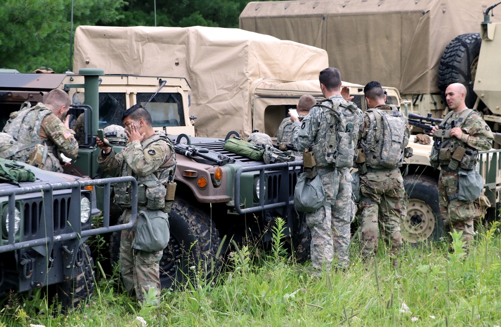 IANG Infantry Soldiers Apply Face Paint at XCTC