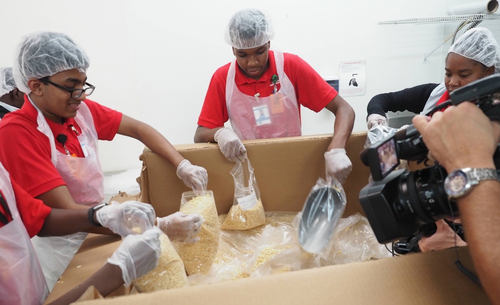 Summer student volunteers give service to local food bank