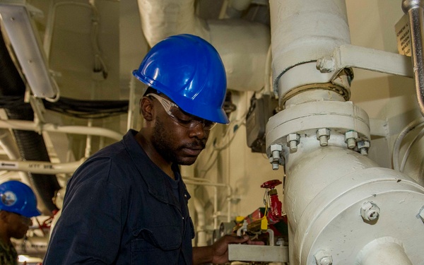 GHWB Sailor Cleans AFFF Pump