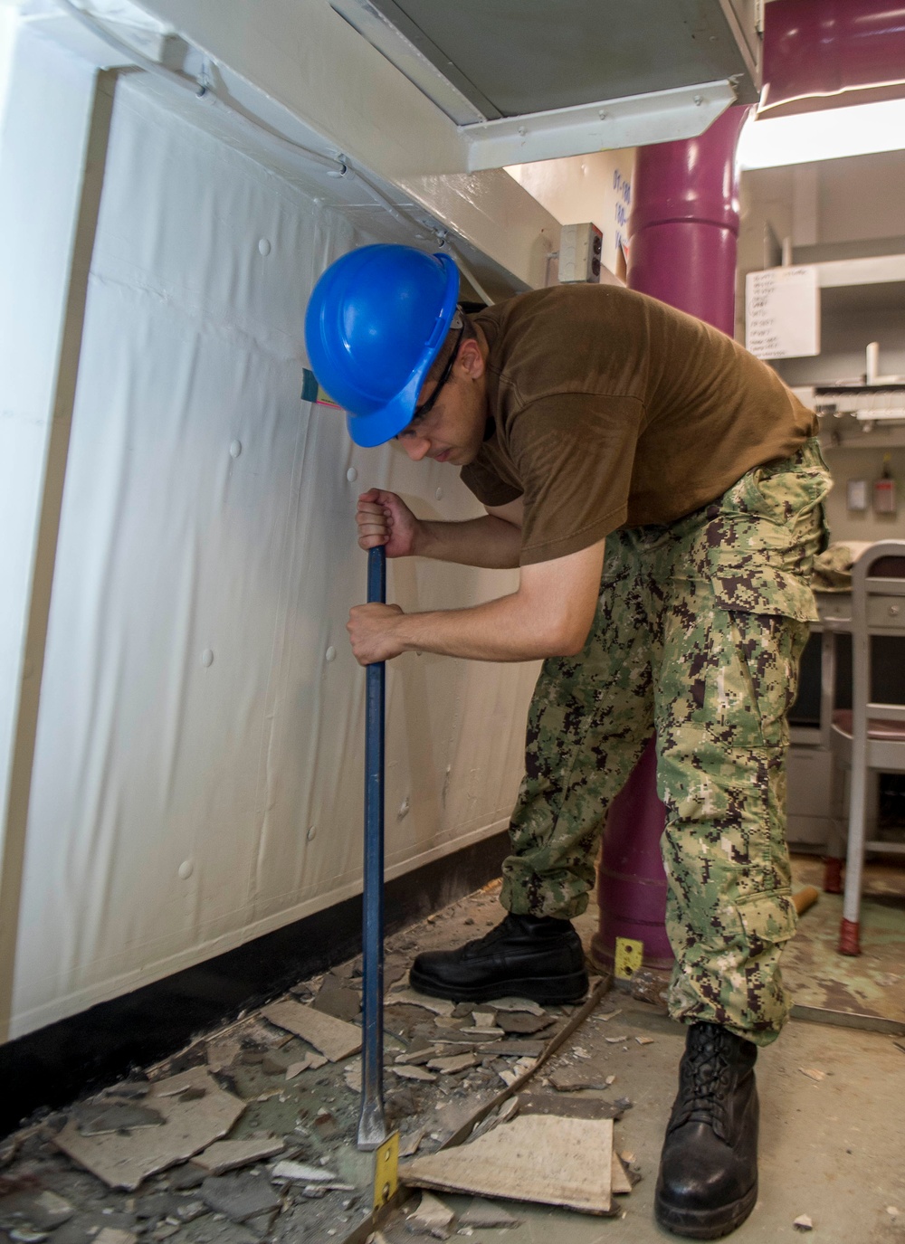 GHWB Sailor Removes Deck Material