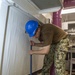 GHWB Sailor Removes Deck Material