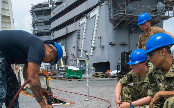 GHWB Sailors Observe Corrosion Control