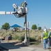 Electricians repair street lamp