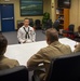 Sailors stand Sailor of the Quarter board at Navy Recruiting District Philadelphia.