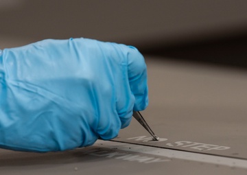 Airmen give F-16s new paint job