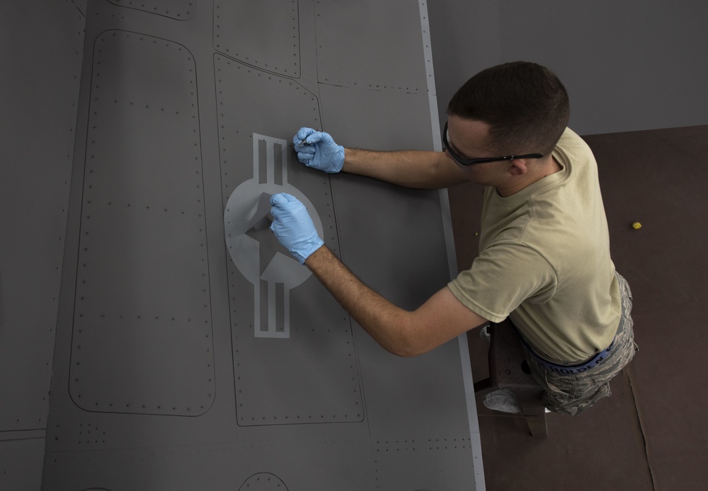 Airmen give F-16s new paint job