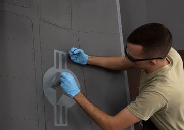 Airmen give F-16s new paint job