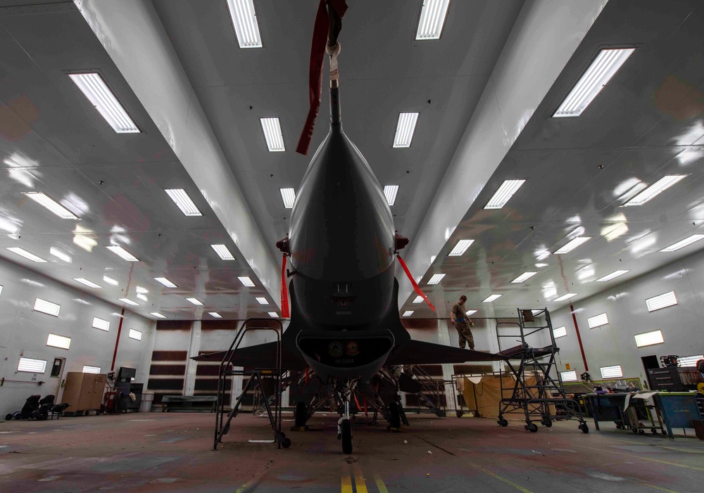 Airmen give F-16s new paint job