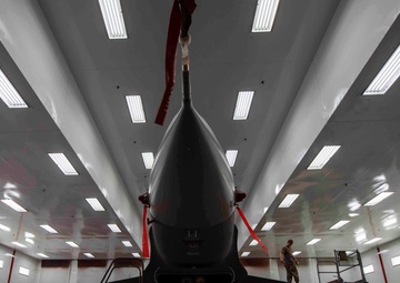 Airmen give F-16s new paint job