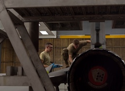 Airmen give F-16s new paint job