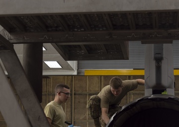 Airmen give F-16s new paint job