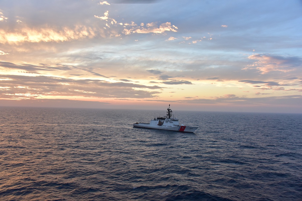 Sun sets over CGC Bertholf in the Yellow Sea