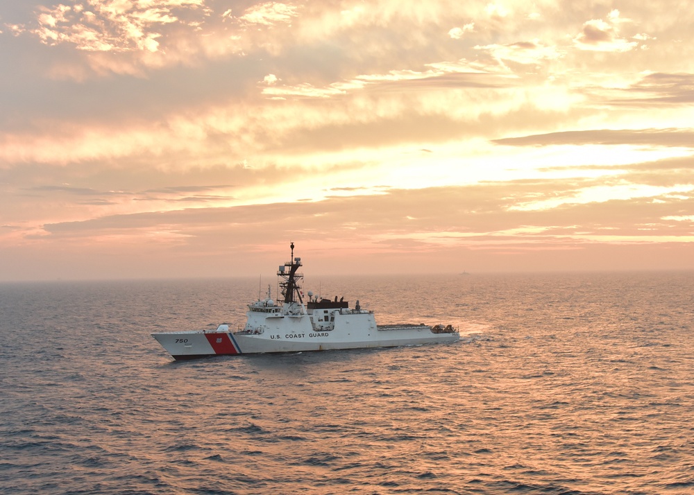 Sun sets over CGC Bertholf in the Yellow Sea