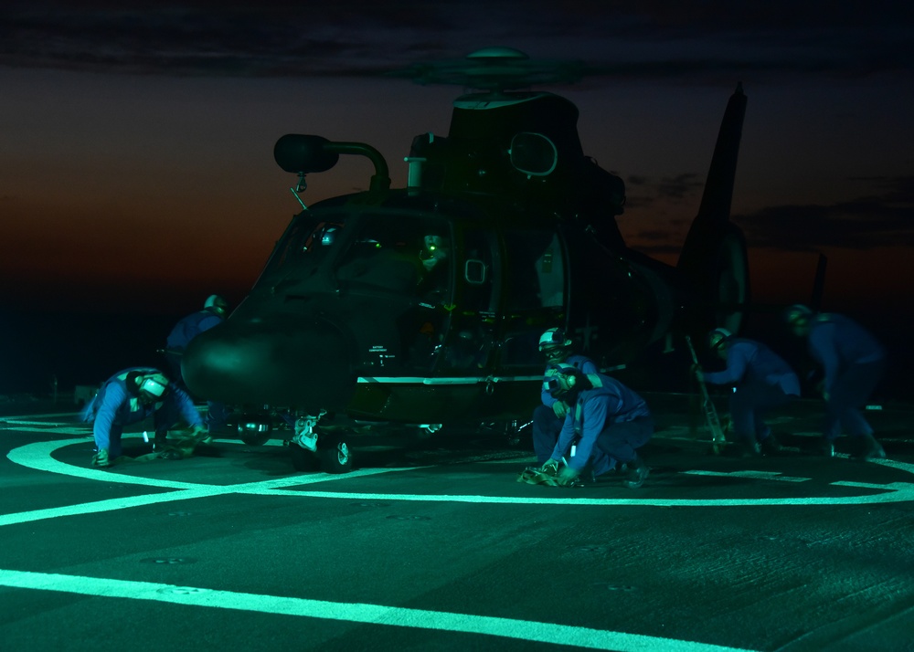 Night launch of CGC Bertholf's embarked helicopter