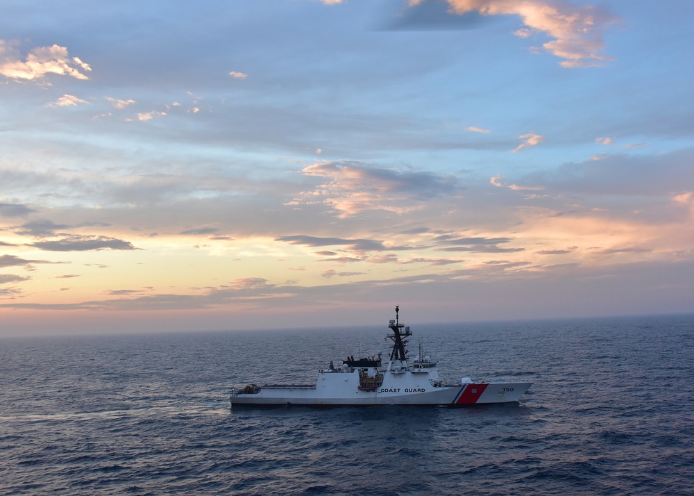 The sun sets over CGC Bertholf in the Yellow Sea