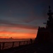 Bertholf crewmembers contemplate spectacular sunset at sea