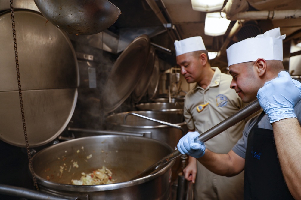 Culinary Specialists prepares a meal aboard Nimitz-class aircraft carrier USS Abraham Lincoln (CVN 72).
