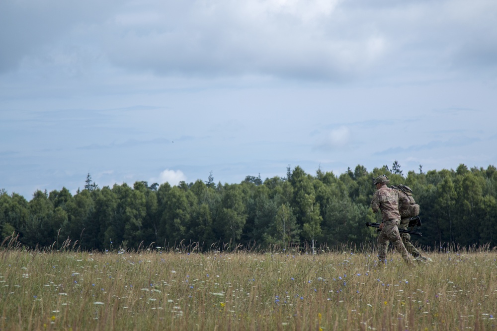 A Czech sniper runs to his next position.