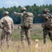 A Czech sniper and spotter engage targets with pistols.