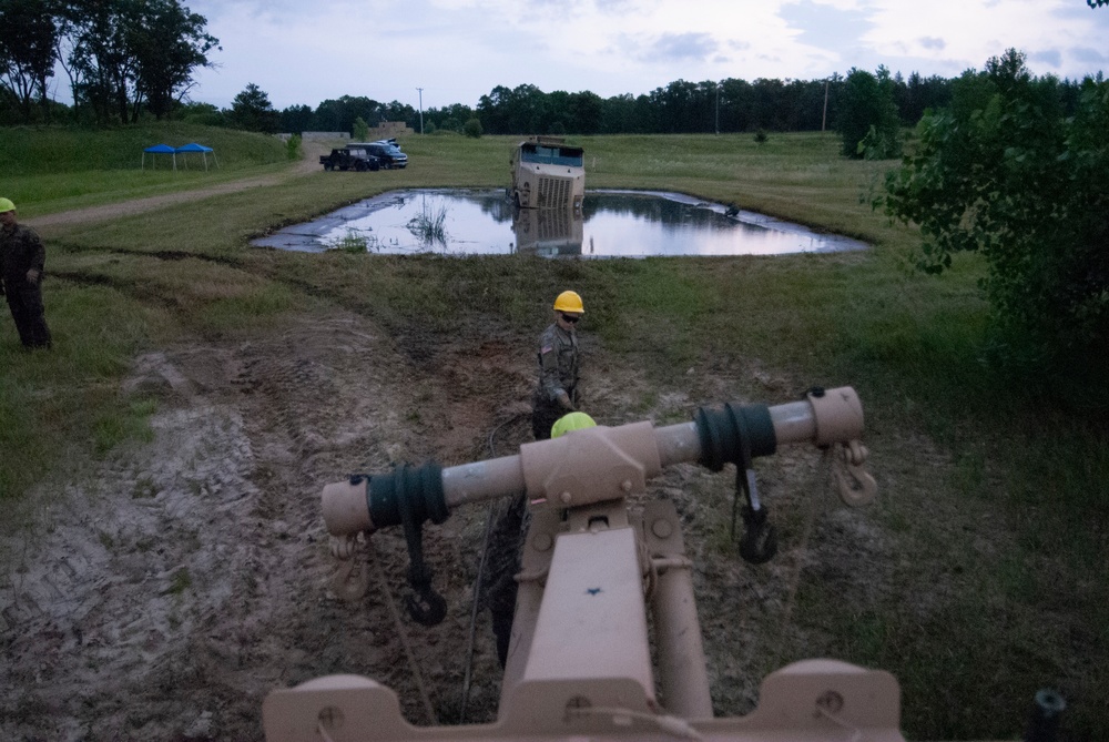 Soldiers dig deep for wheeled vehicle mechanic training