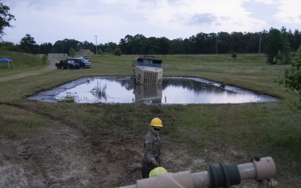 Soldiers dig deep for wheeled vehicle mechanic training