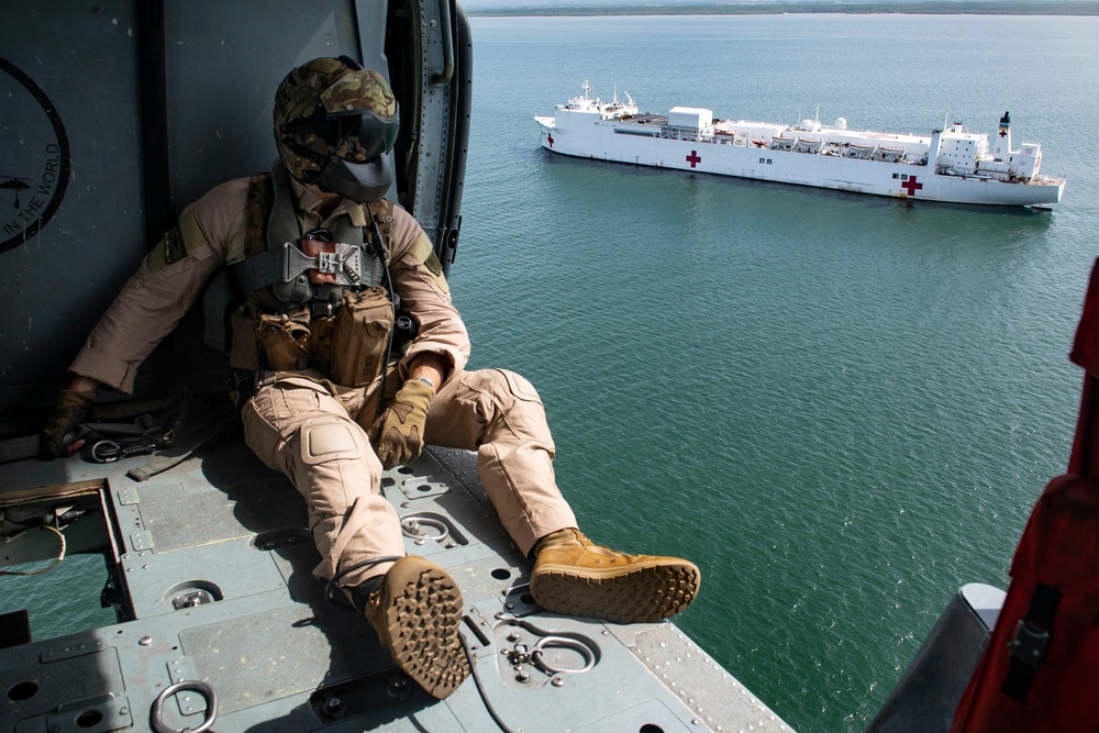 USNS Comfort transports supplies to temporary medical sites
