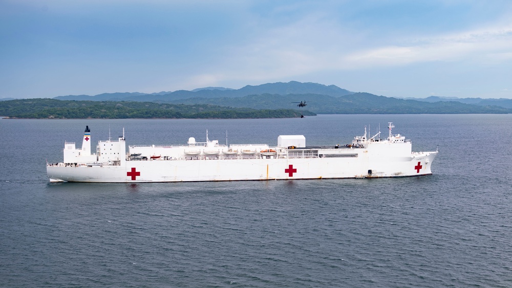 USNS Comfort transports supplies to temporary medical sites