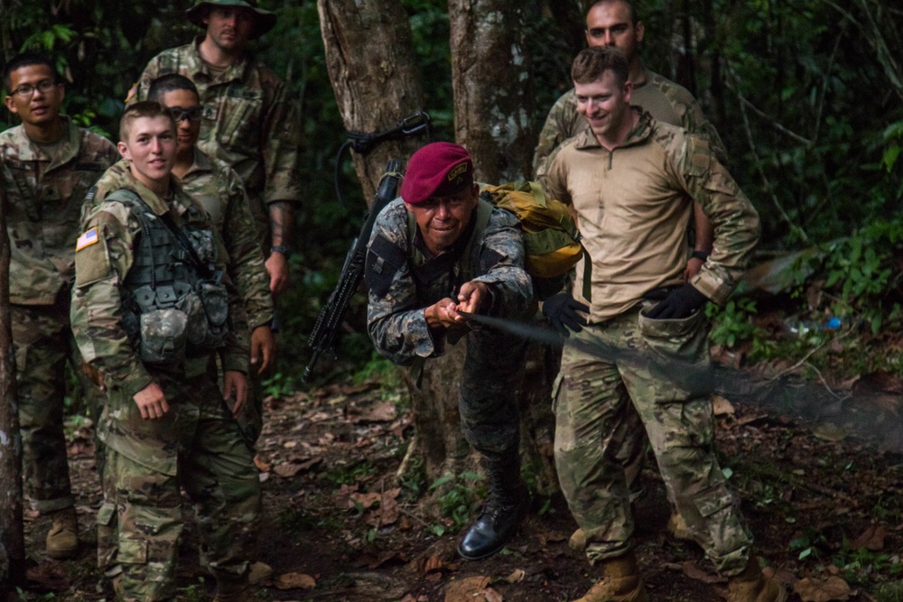 US soldiers trek through the jungle with Guatemala special forces
