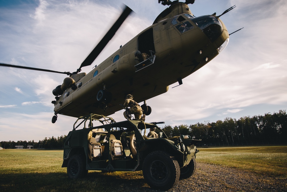 U.S. Army paratroopers sling load a Ground Mobility Vehicle