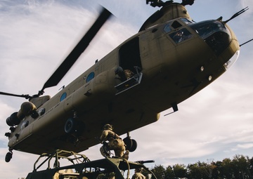 U.S. Army paratroopers sling load a Ground Mobility Vehicle