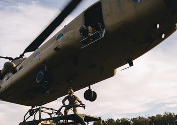 U.S. Army paratroopers sling load a Ground Mobility Vehicle