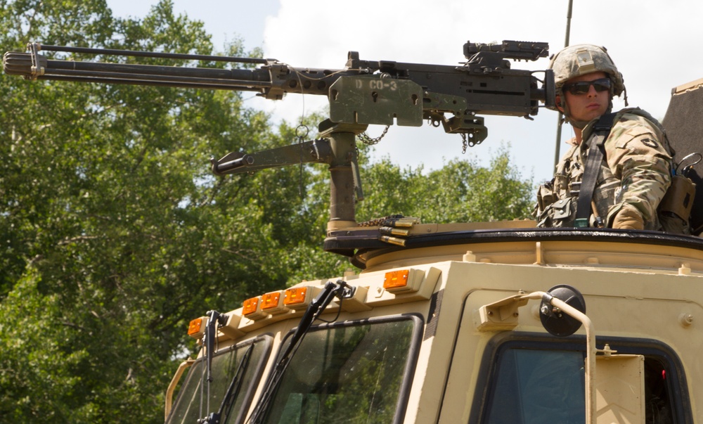 Pfc. Justin Welch Mans Machine Gun